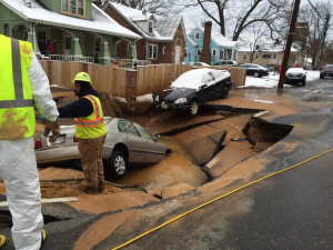 Car sinkhole water main