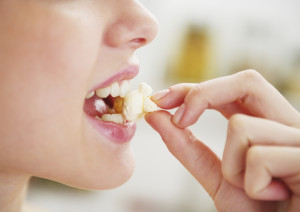 Woman eating popcorn