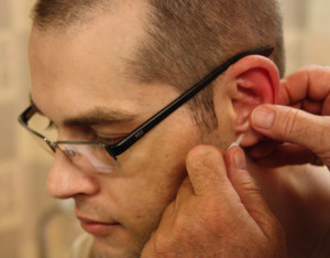 Captain Johyn Sears gets an acupuncture treatment at Walter Reed
