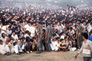 A large crowd attends the cremation cere