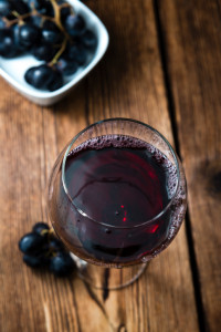 Red Wine (close up shot) on vintage wooden background