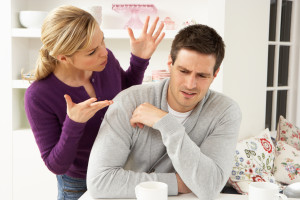 Young couple arguing in their home