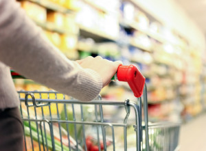 Weird side angle view of woman shopping in supermarket