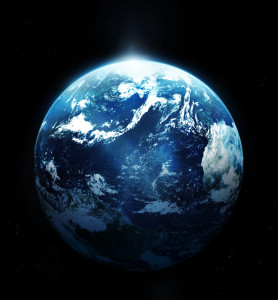 Planet earth with sun rising from space
