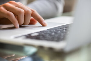 Female using keyboard computer indoor