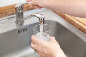 Woman tap water