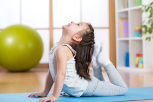 Child girl doing gymnastics