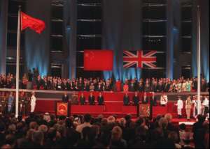 CHINESE FLAG FLIES UNION JACK LOWERED