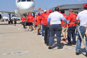 Competitors at the 2014 plane pull.