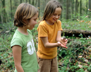 Girls playing with frog
