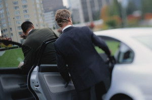 Businessmen Getting Into a Car