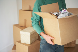 Man Carrying Cardboard Box