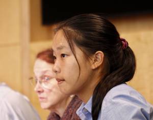15 year old Council member for a day Angela Wu listens to testimony from the dais.