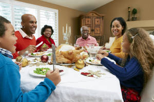 Multi Generation Family Celebrating With Christmas Meal