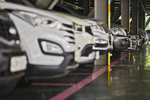 Parking garage, underground interior with a few parked cars