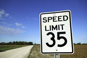 Speed limit sign in rural setting