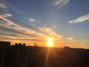 Sun setting over the United States Capitol on a clear