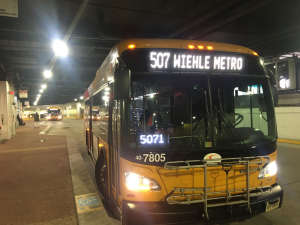A Fairfax Connector bus at the Wiehle Reston East bus bay. (WTOP/Max Smith)