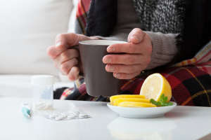Ill man and hot drink
