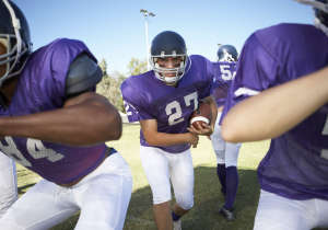 Running Back behind Linemen