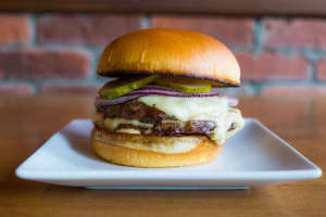 The Standard double beef patty, white american cheese, shaved onion, special sauch
