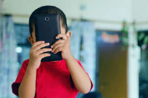 Child taking picture with mobile phone camera