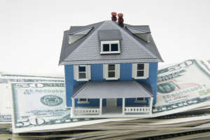 House on stack of money