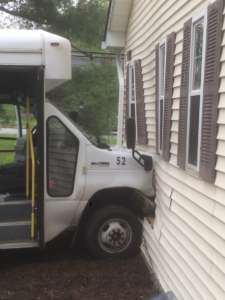 BUS INTO HOUSE