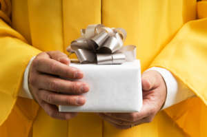 Graduate holding a gift