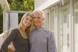 Man and a young woman embracing each other and smiling