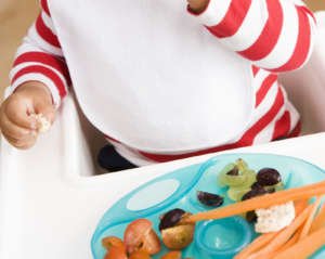 Baby eating vegetables