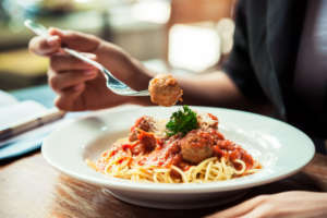 Woman eating spaghetti