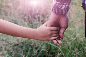 A girl holding hands with father,Vintage filters.