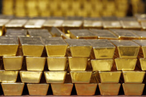 Gold bars stacked in a vault