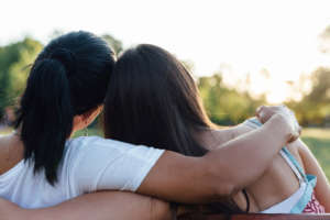 Mom and daughter embracing