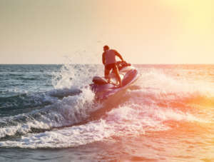 Silhouette of man on jetski at sea