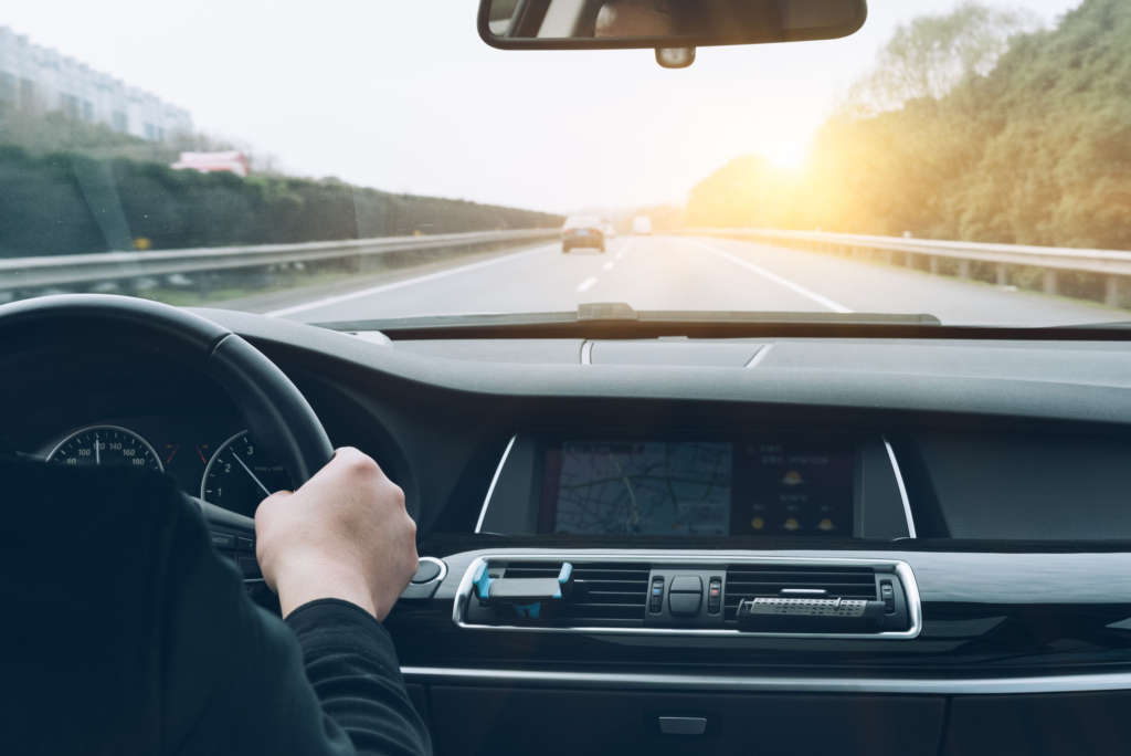 Man driving car from rear view