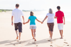 Family walking on beach