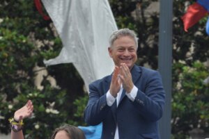 Celebrity Grand Marshall, Gary Sinise, stands with children from the Snowball Express program during the 2018 National Memorial Day Parade. preview