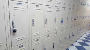 School lockers off white, black and white tile floor