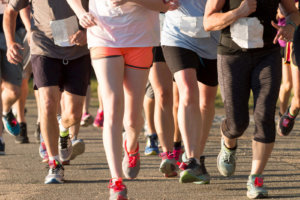 Large pack of runners during a 5K race
