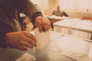 Person voting at polling station