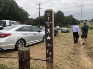 A sign marks the beginning of the new trail. (WTOP/Mike Murillo)