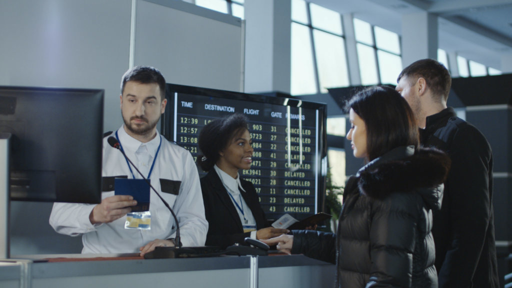 Airport workers checking documents at control point