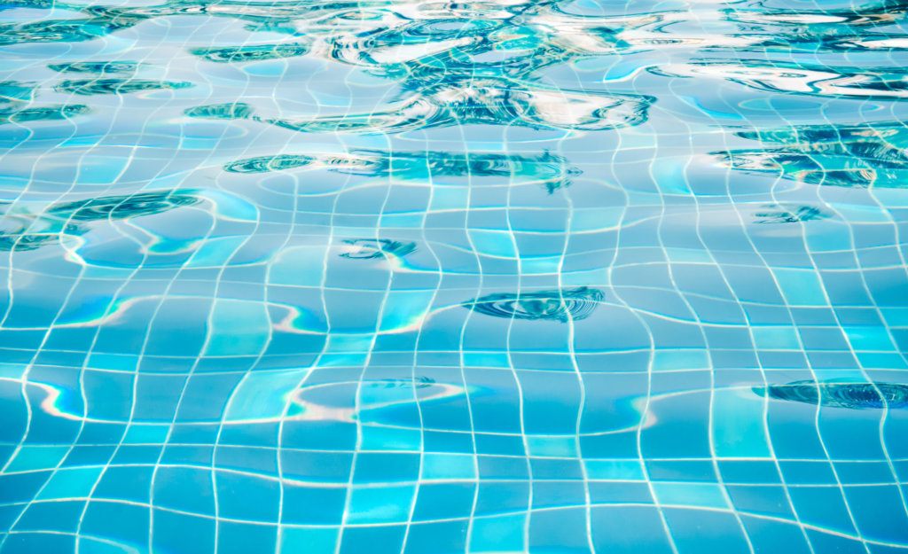 Background of rippled water in swimming pool