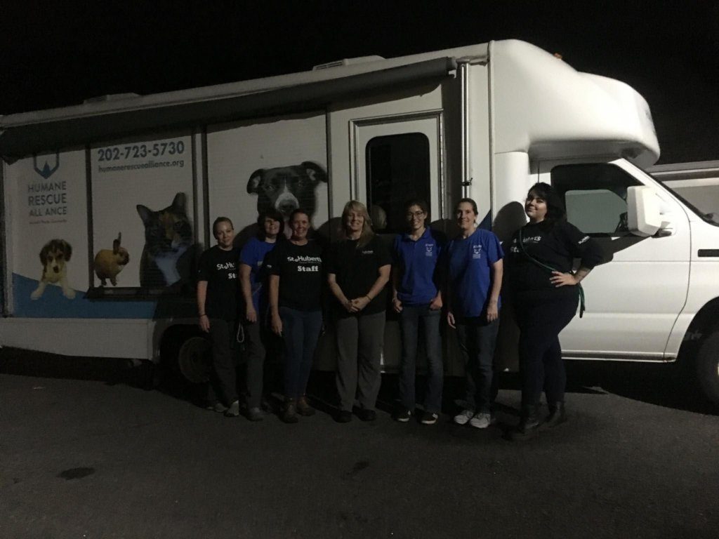 Group photo of Humane Rescue Alliance workers after unloading 54 dogs brought in from Louisiana shelters ahead of Hurricane Barry on Friday.