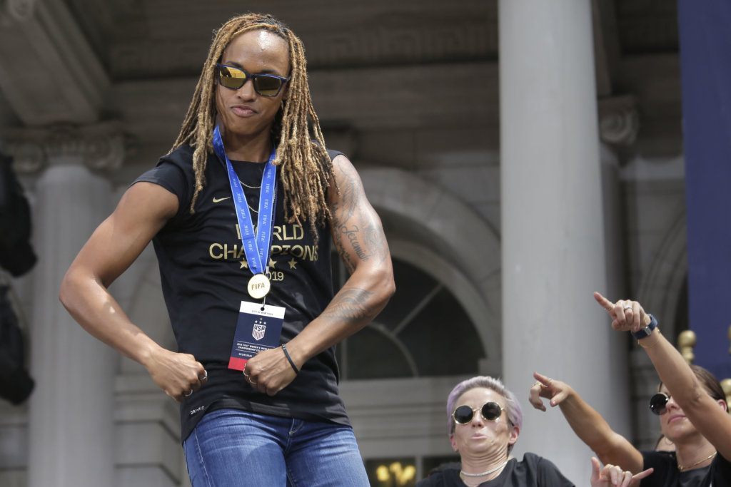 The U.S. women's soccer team member Jessica McDonald flexes during a celebration at City Hall after a ticker tape parade, Wednesday, July 10, 2019, in New York. The U.S. national team beat the Netherlands 2-0 to capture a record fourth Women's World Cup title. (AP Photo/Seth Wenig)