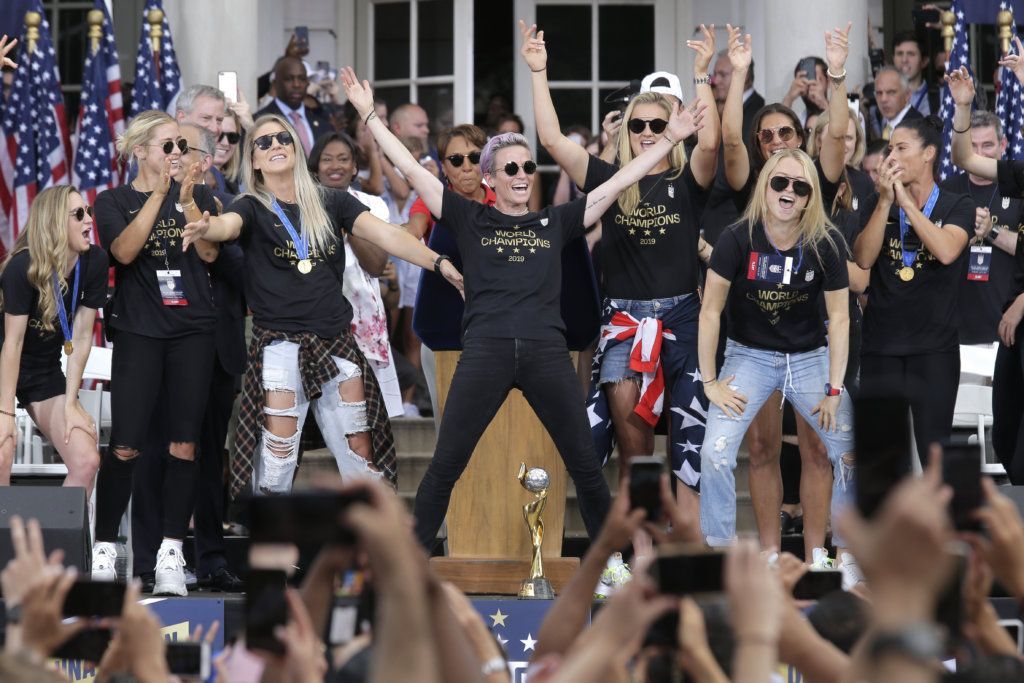 The U.S. women's soccer team is celebrated at City Hall after a ticker tape parade, Wednesday, July 10, 2019 in New York. The U.S. national team beat the Netherlands 2-0 to capture a record fourth Women's World Cup title. (AP Photo/Seth Wenig)