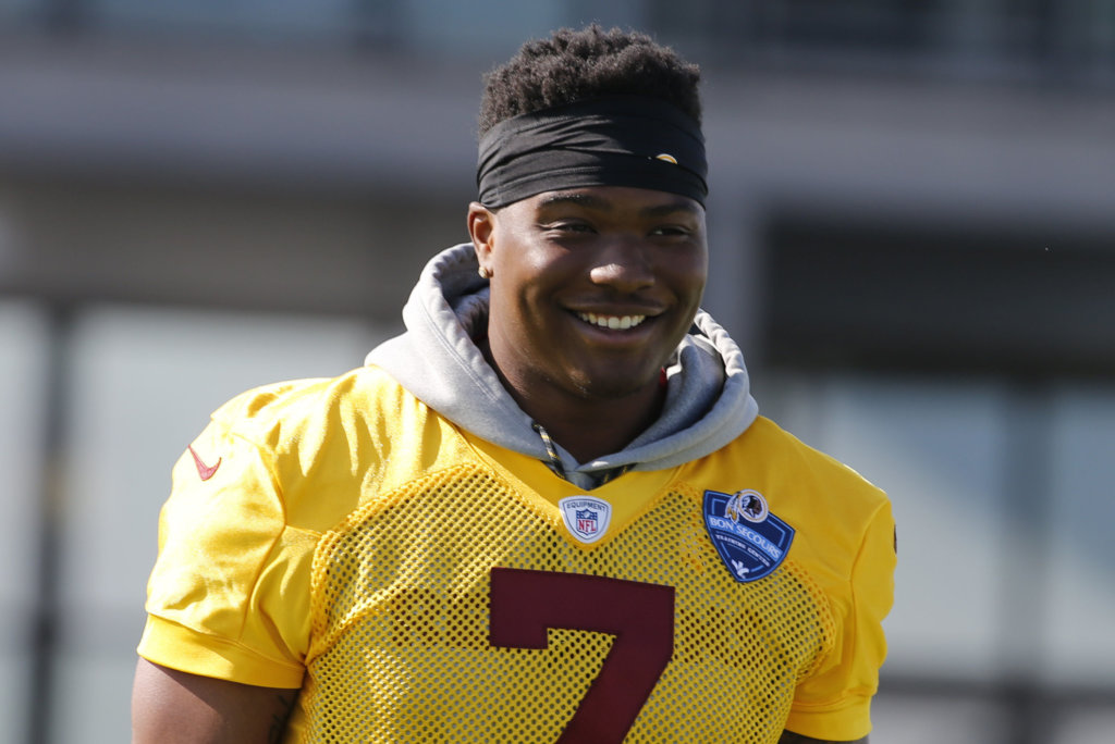 Washington Redskins quarterback Dwayne Haskins Jr. (7) heads to the practice field during the first day of the Washington Redskins NFL football training camp in Richmond, Va., Thursday, July 25, 2019.