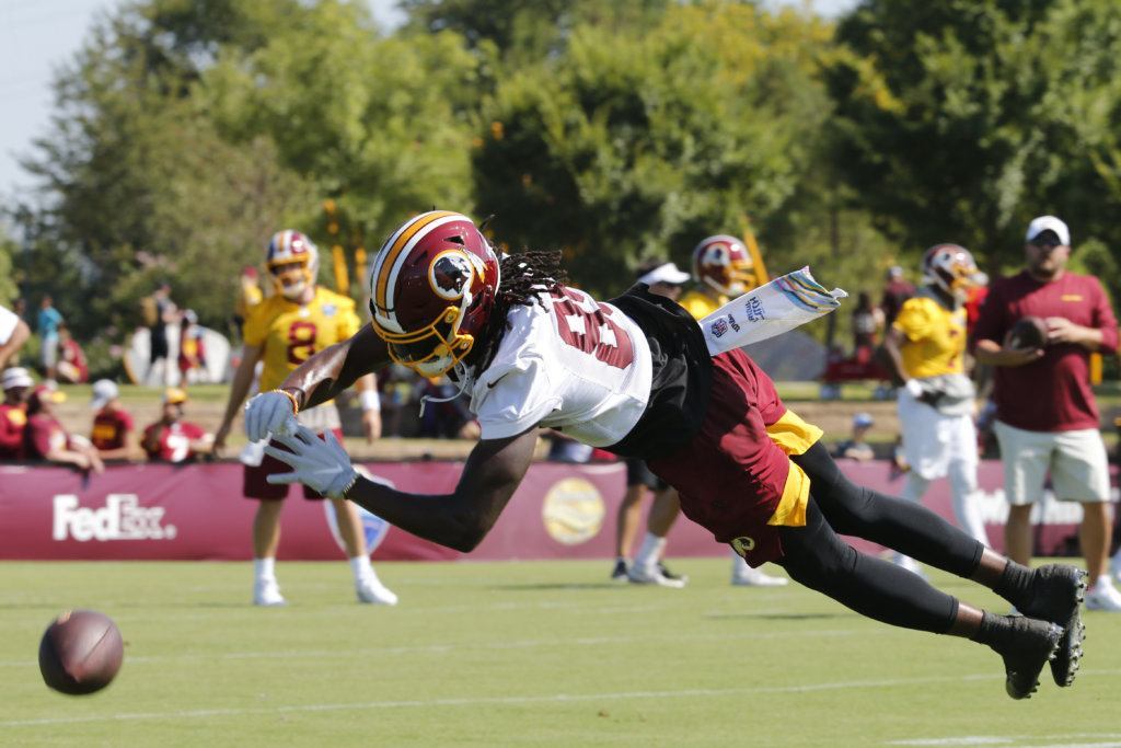Washington Redskins wide receiver Matt Flanagan (88) stretches out for a pass during the first day of NFL football training camp in Richmond, Va., Thursday, July 25, 2019.